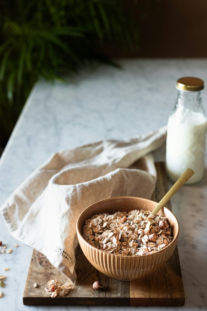 ashwagandha root and powder in a wooden bowl