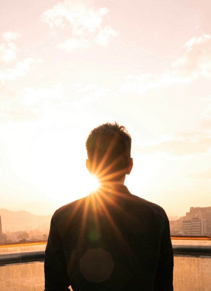 Man outdoors in sunlight, illustrating the benefits of vitamin D from sun exposure
