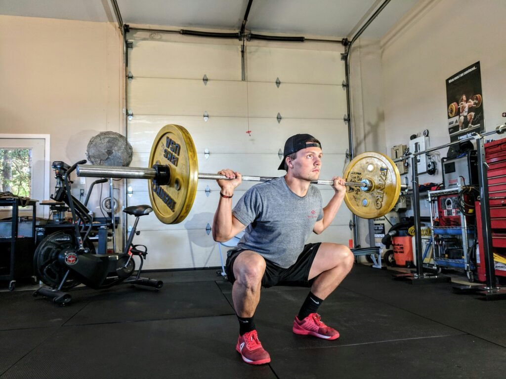 lean muscular man who managed to build muscle in a deficit, measuring waist