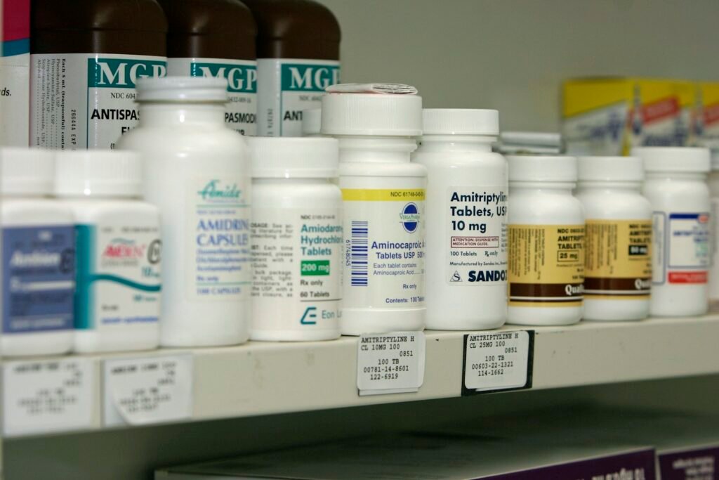 testosterone booster supplements - assortment of supplement bottles on a shelf, neutral lighting