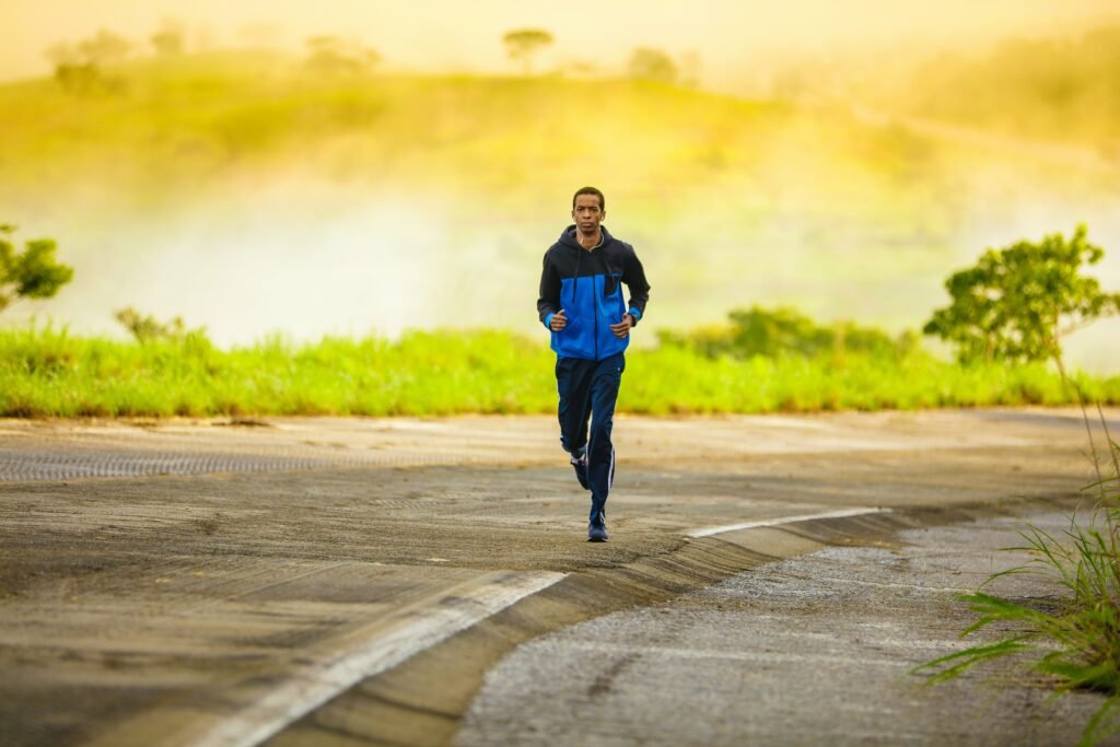 active middle-aged man jogging outdoors, disproving metabolism slowing with age