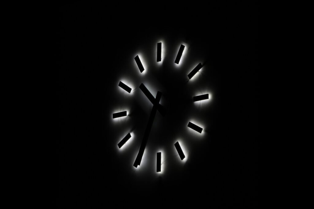 Dark bedroom clock showing frequent urination at night concern