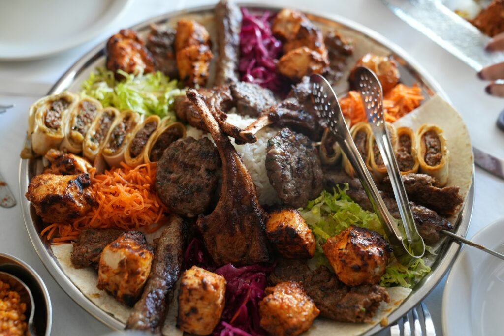 variety of high protein foods laid out: meat, fish, eggs, dairy, legumes