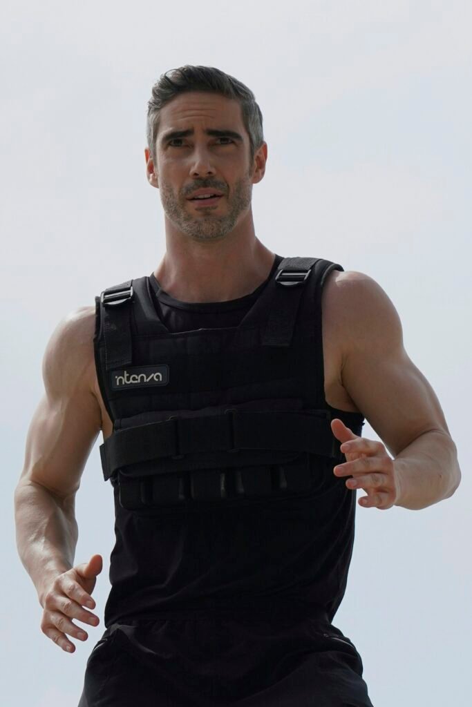 fit man who has learned how to lose belly fat after 40, flat stomach and active