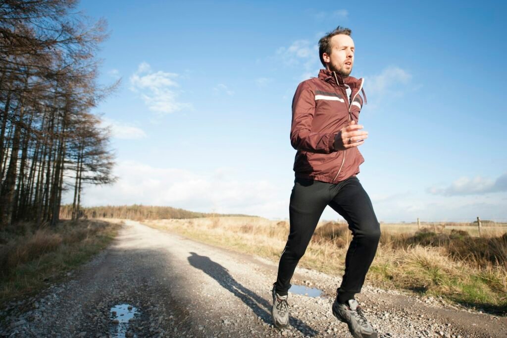 Man jogging outdoors, representing how to lose weight quickly and safely through daily cardio