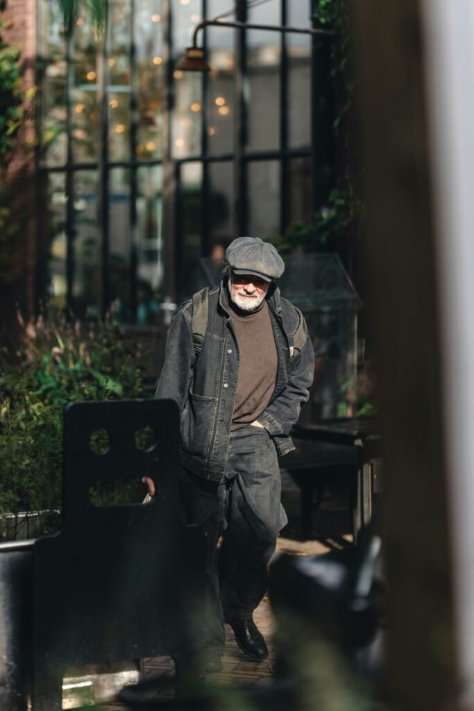 active older man practicing longevity habits by walking outdoors