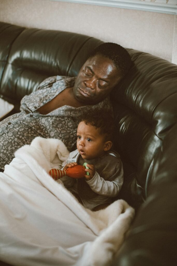 Man napping on a couch to see if naps are good for you