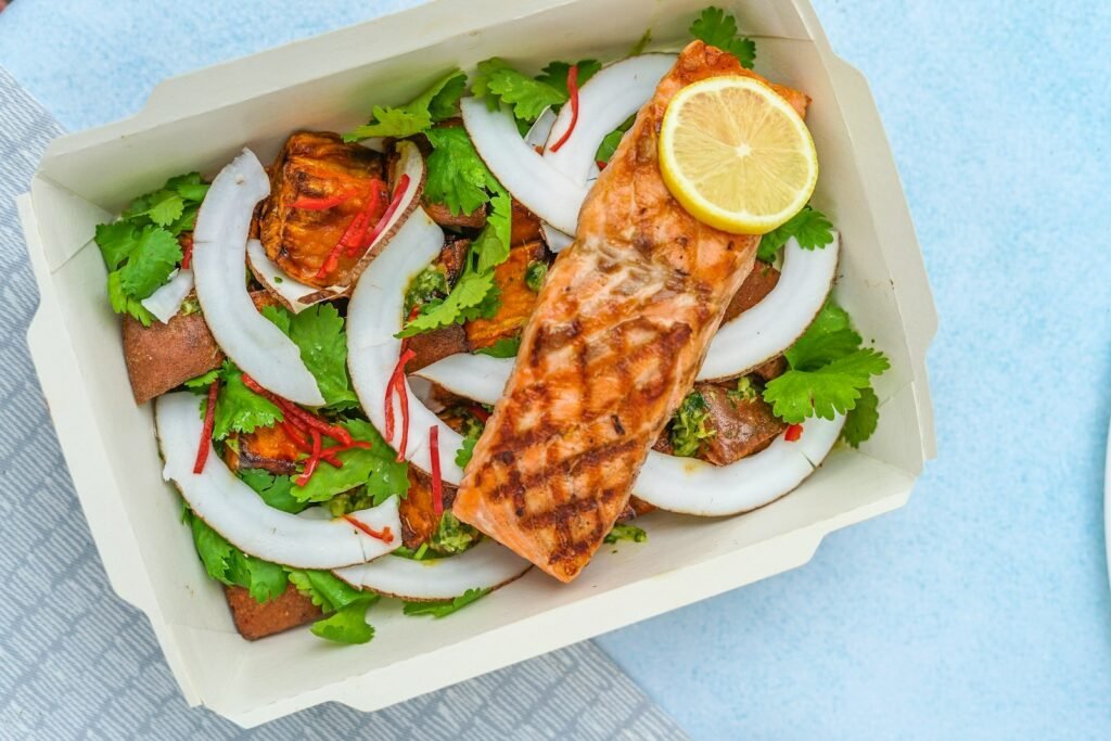 omega 3 benefits for men - grilled salmon fillet with lemon on a plate