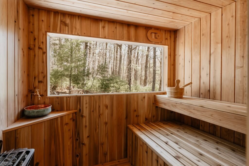 Wooden sauna interior illustrating sauna and cold plunge benefits