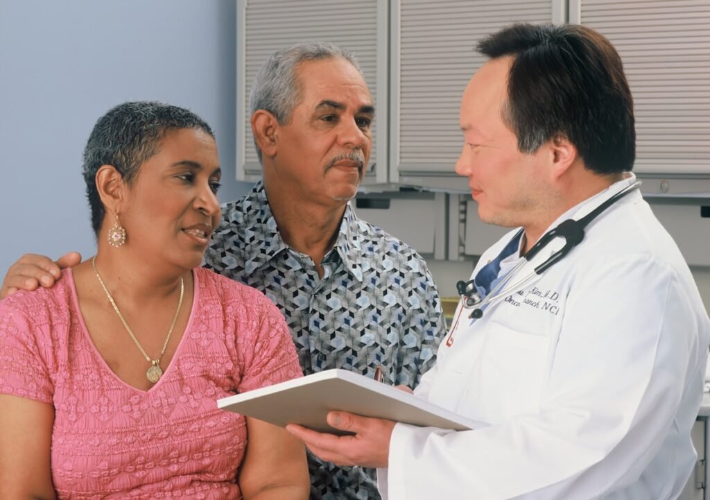 Man discussing symptoms men should not ignore with his doctor