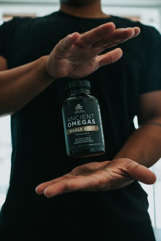 man skeptical of testosterone myths, reading supplement label