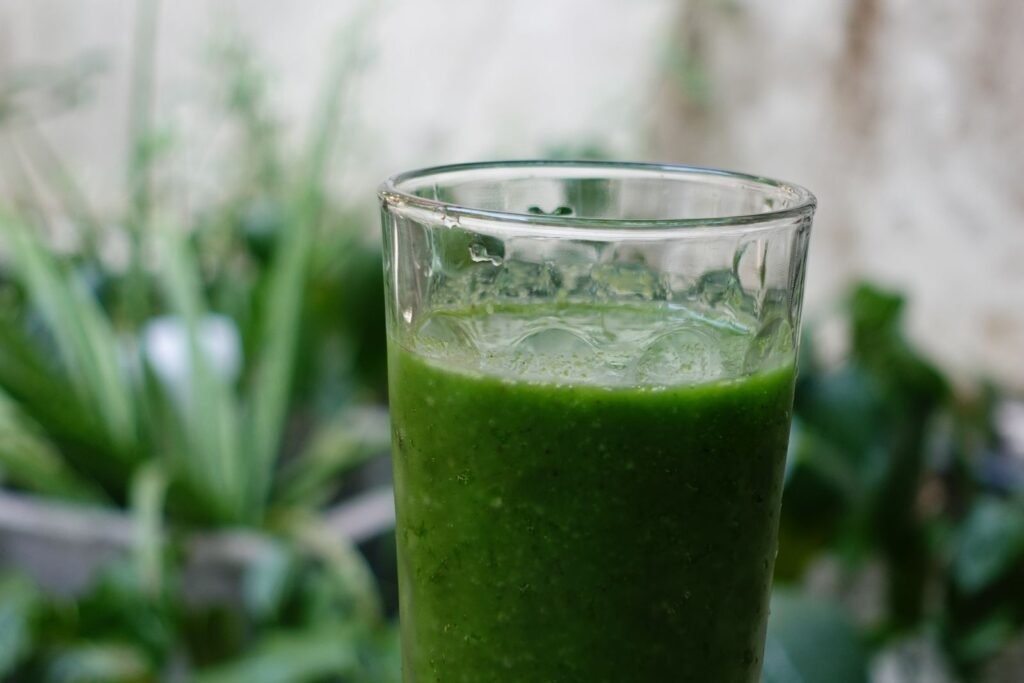 Green vegetable drink in a clear glass