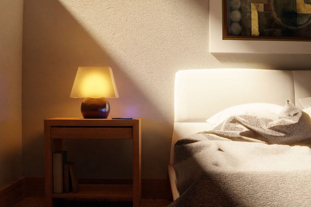 Bedside lamp glowing in a quiet bedroom