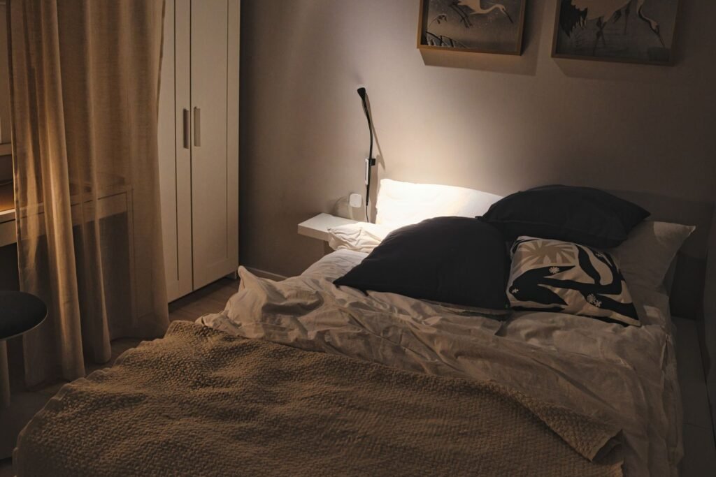 Cool, softly lit bedroom with cosy linens