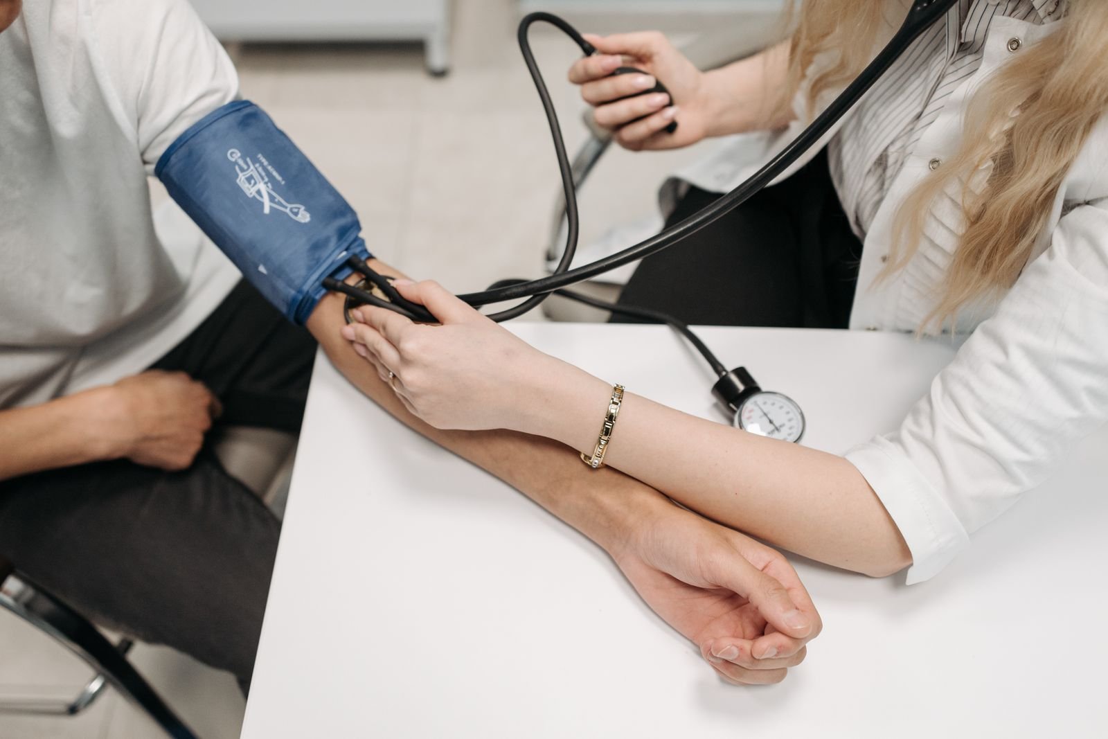 Blood pressure cuff fitted to a patient arm