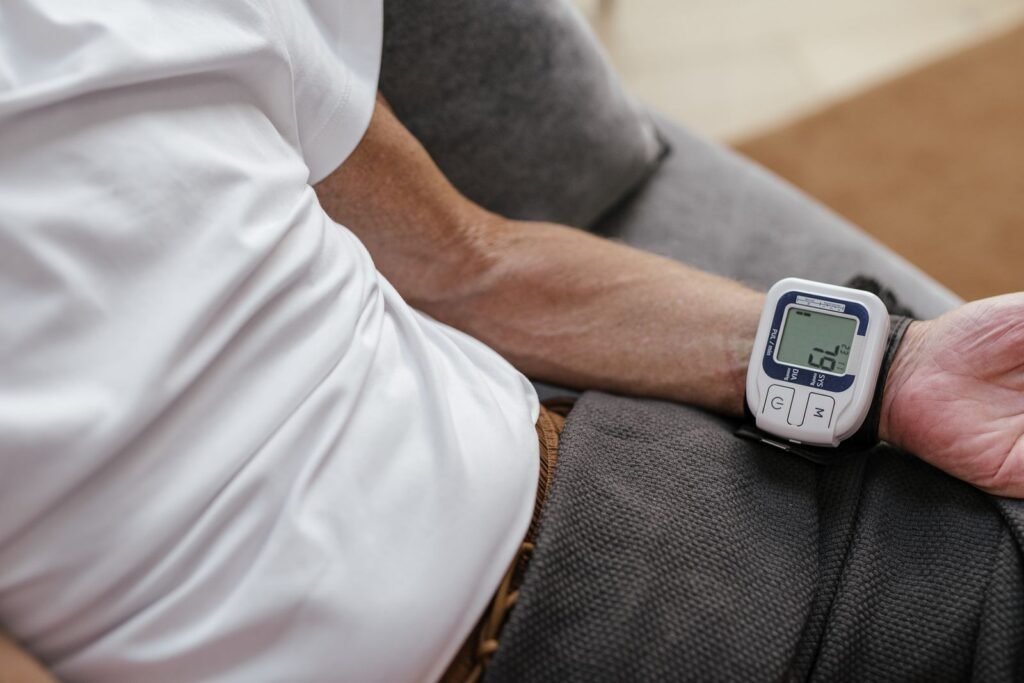 Man measuring his blood pressure with a wrist monitor