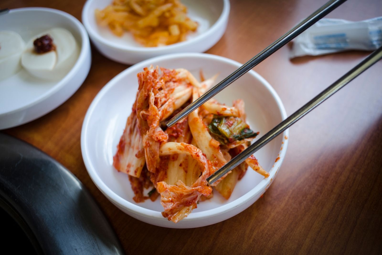 Bowl of kimchi with chopsticks