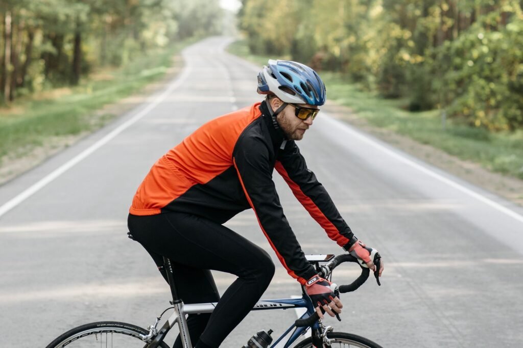 Male cyclist riding a road bike on a scenic route