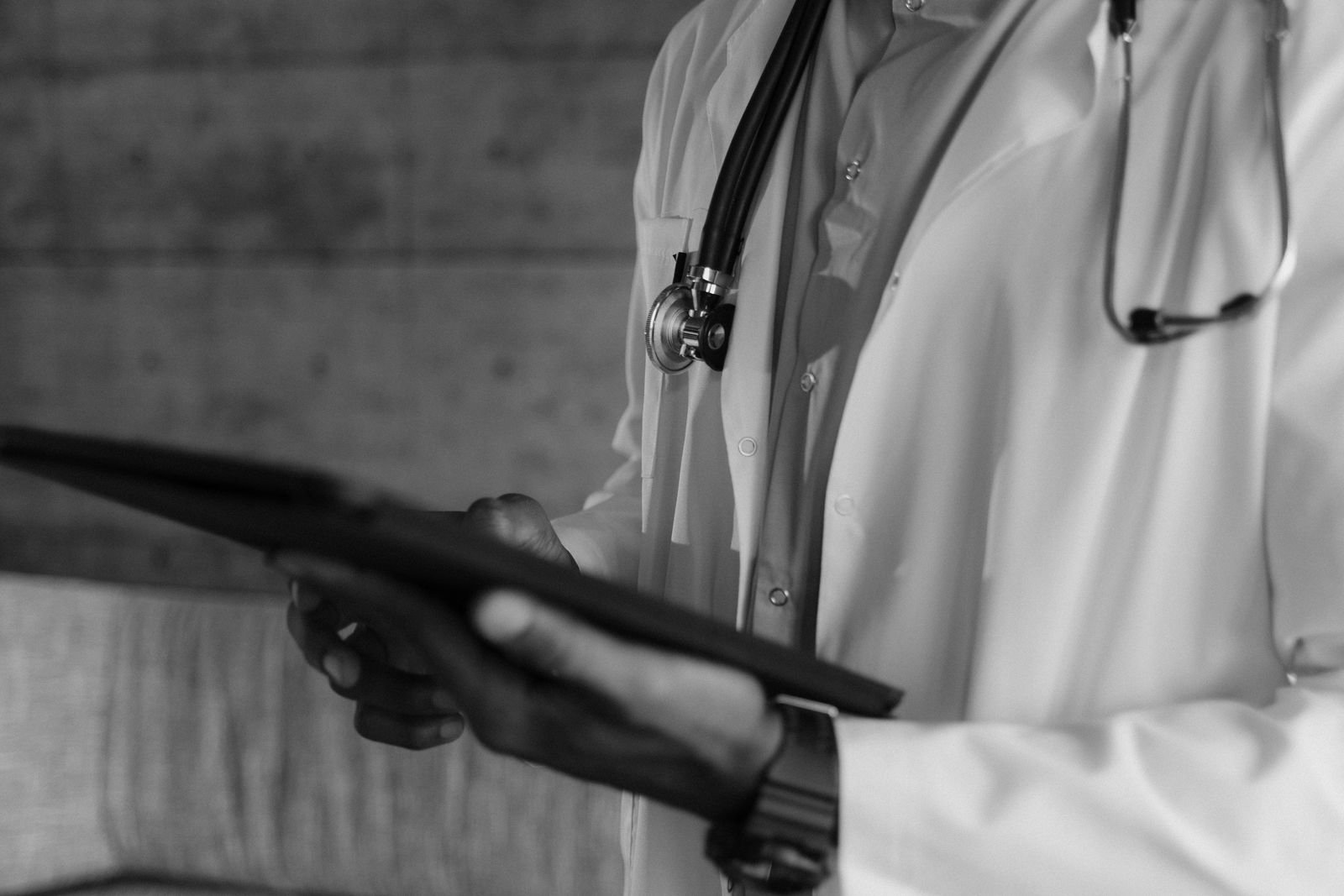 Doctor holding a tablet, black and white