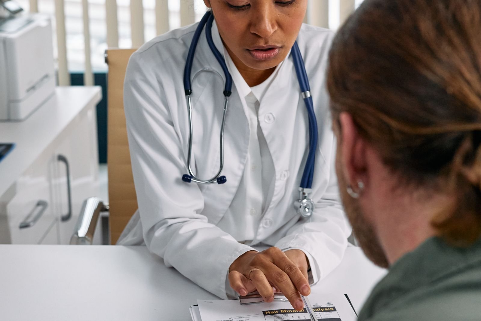 Doctor talking through results with a patient