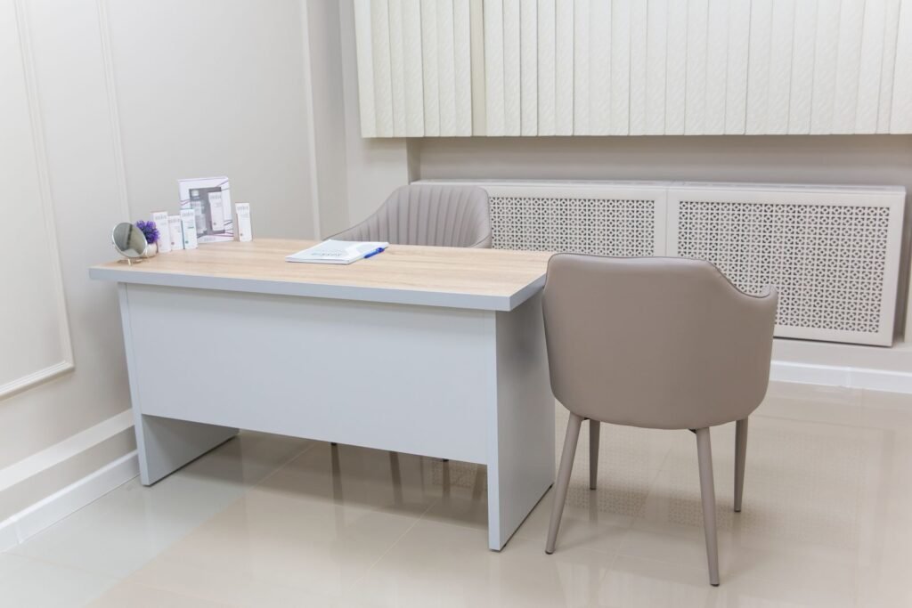Empty doctor's office with a desk and chairs