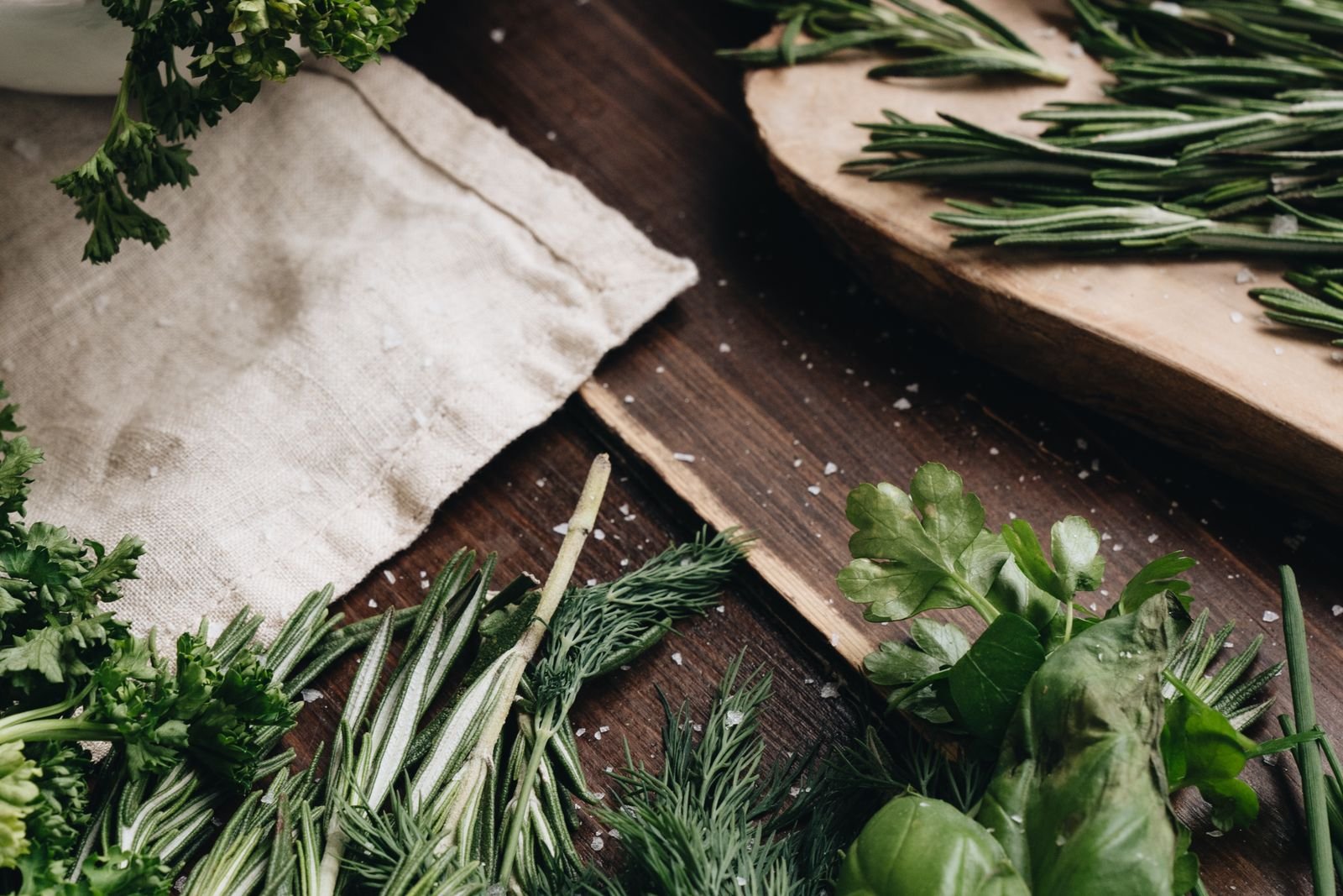 Fresh herbs laid out on a work surface