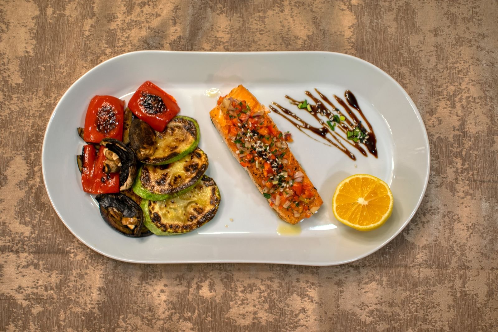Grilled salmon served with asparagus and lemon