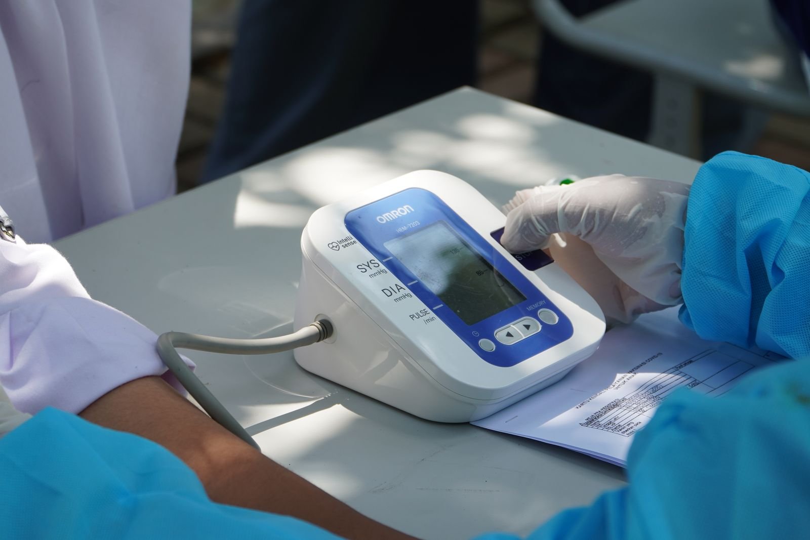 Health worker checking a patient's blood pressure