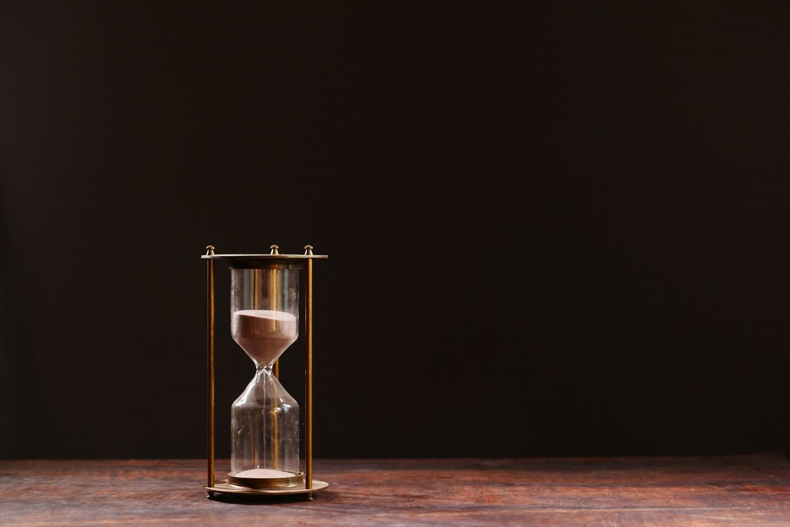 Hourglass on a wooden table