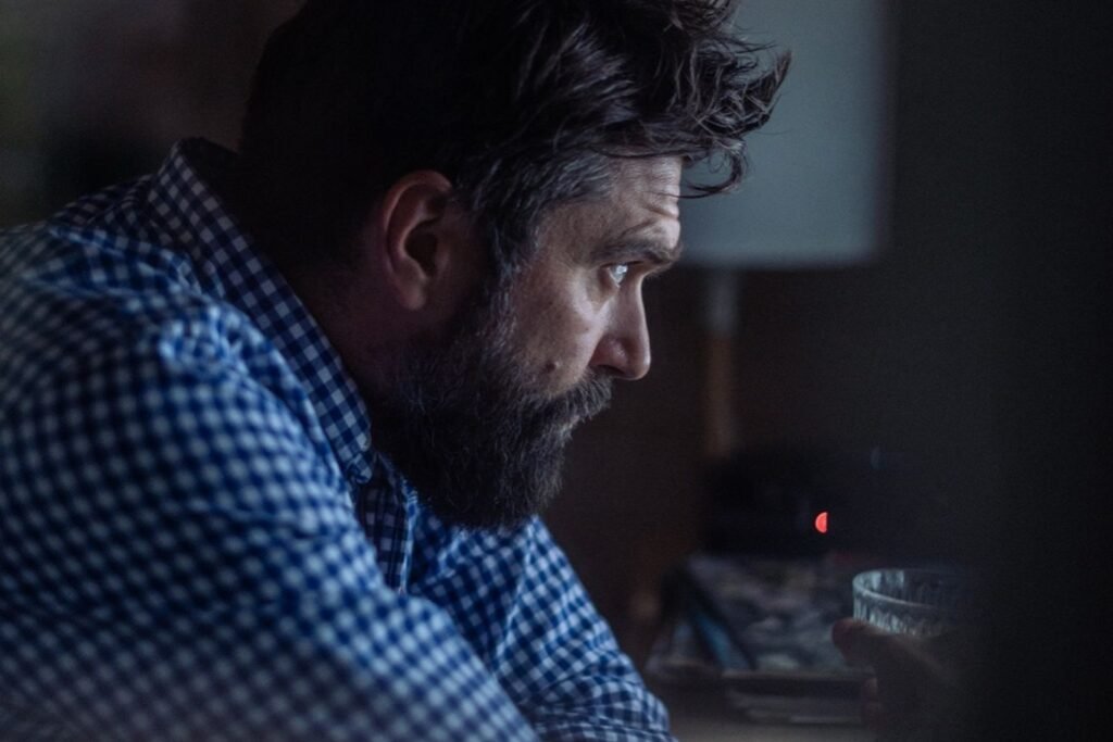 Man working with focused concentration at a desk