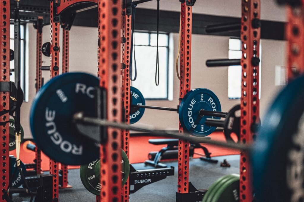 Gym floor with barbells, weight plates and machines
