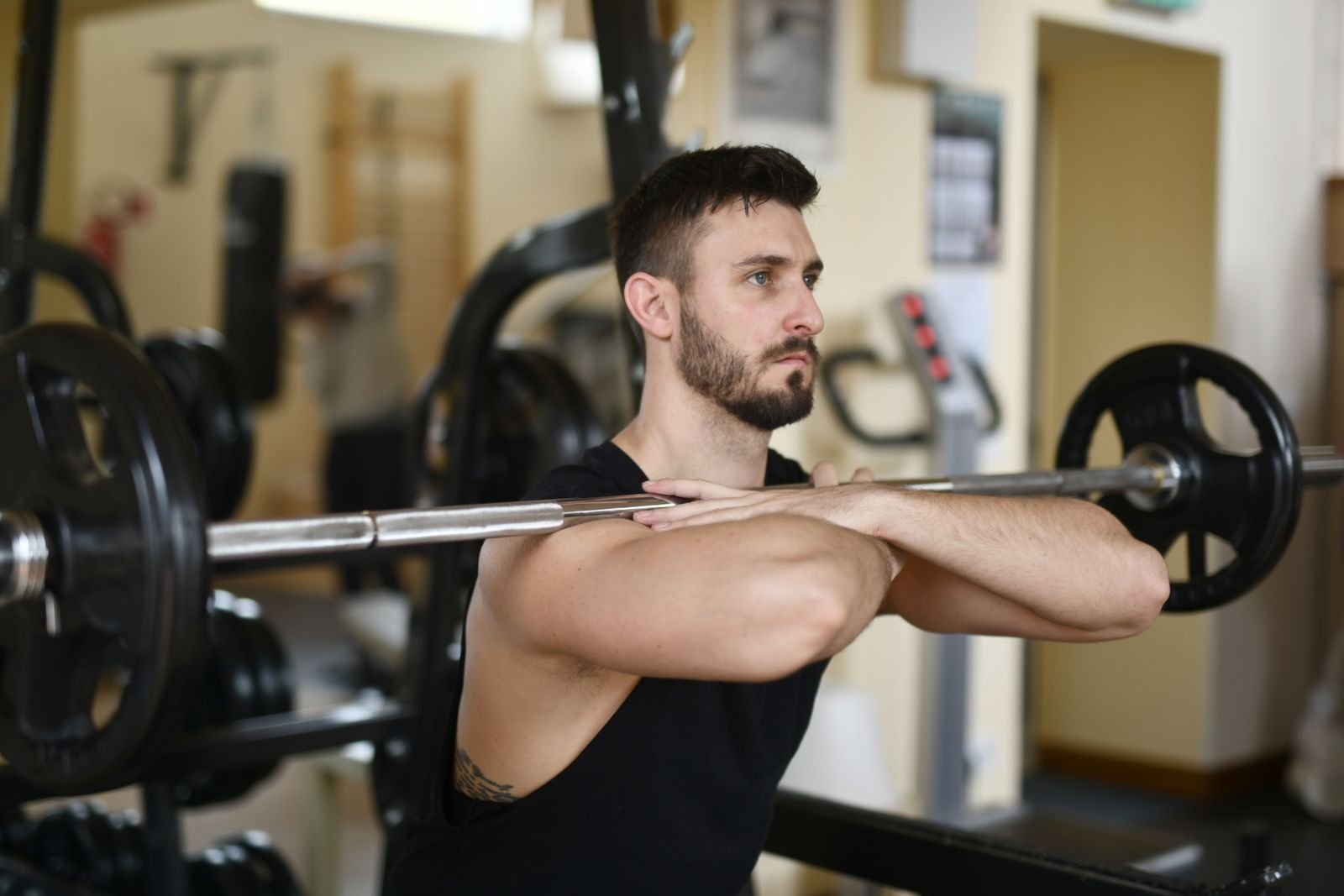 Man doing a front squat with a barbell