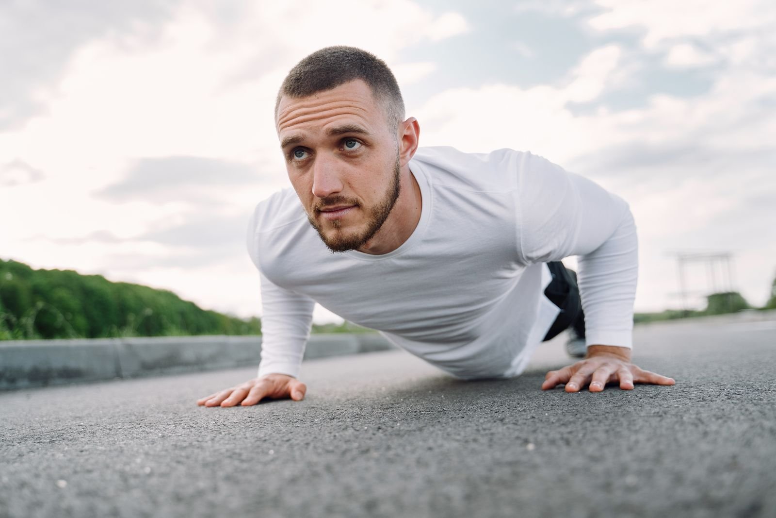 Man doing a push-up outdoors
