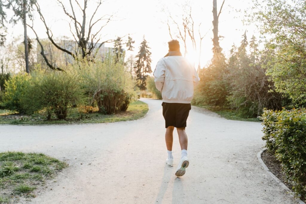 Man jogging away along a park path