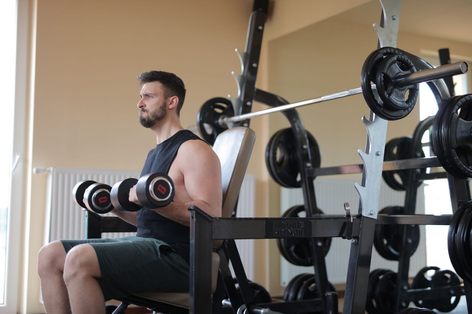 Man lifting dumbbells in a gym
