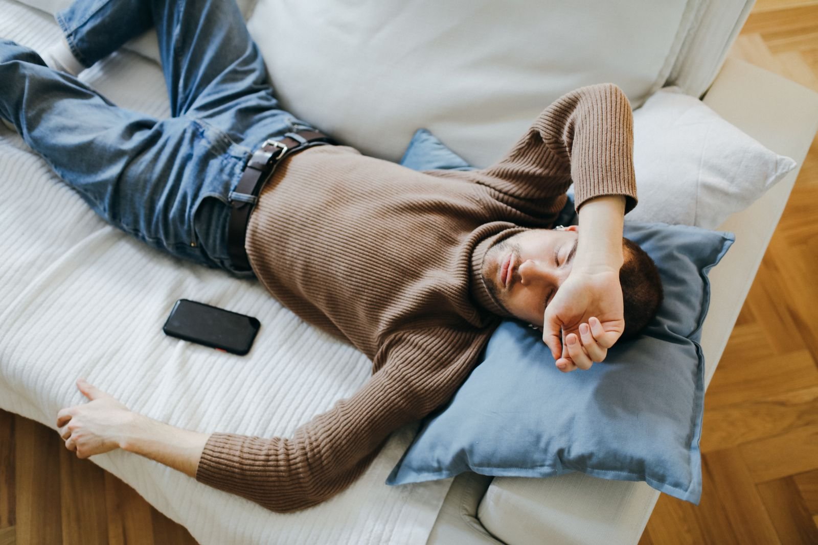 Man resting on a sofa at home
