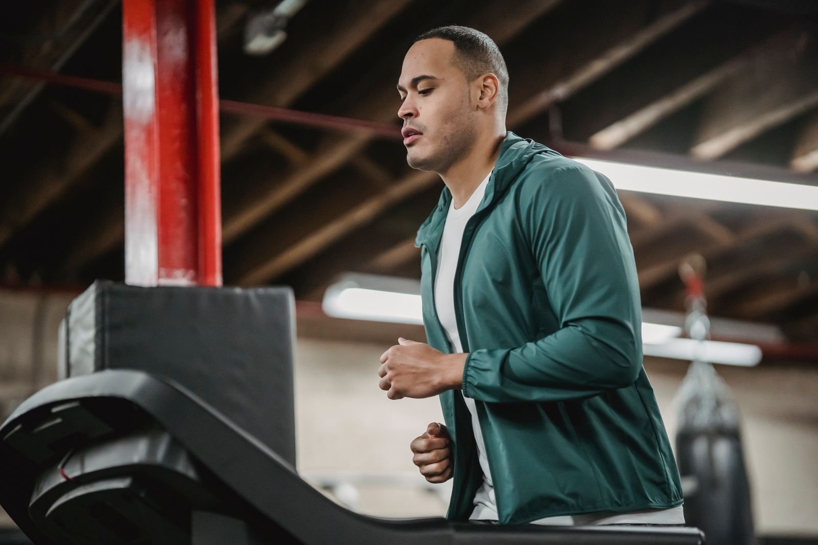 Man running on a treadmill in a gym