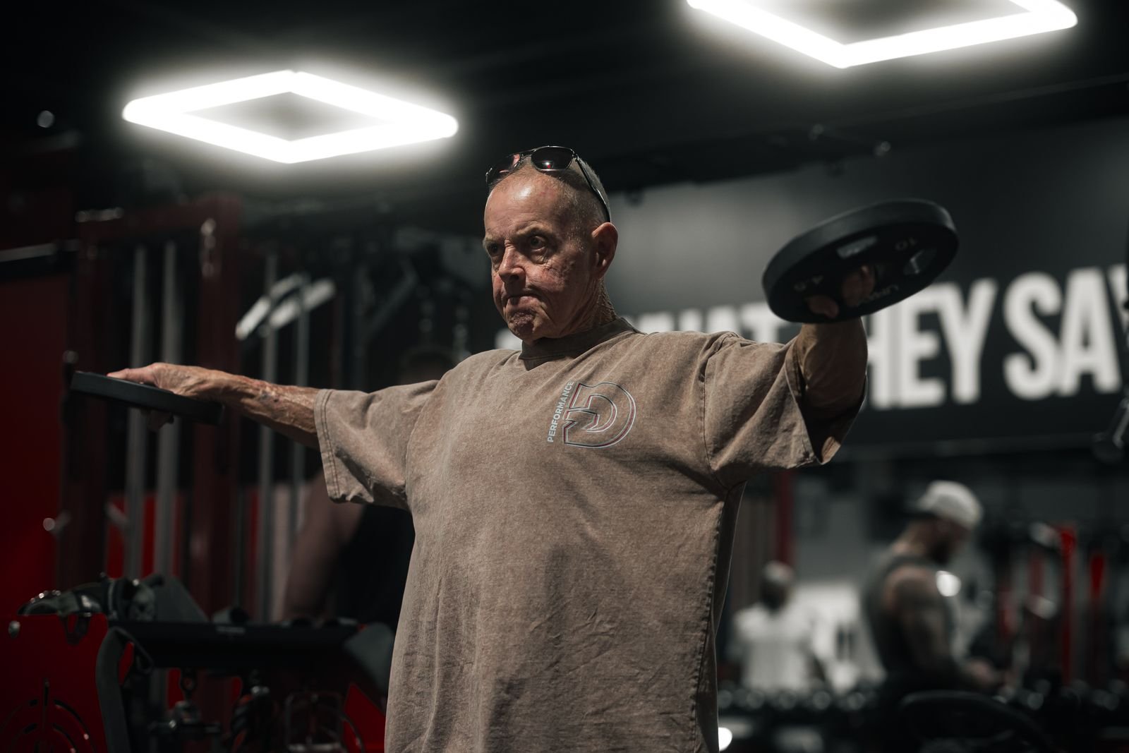 Older man exercising in a gym