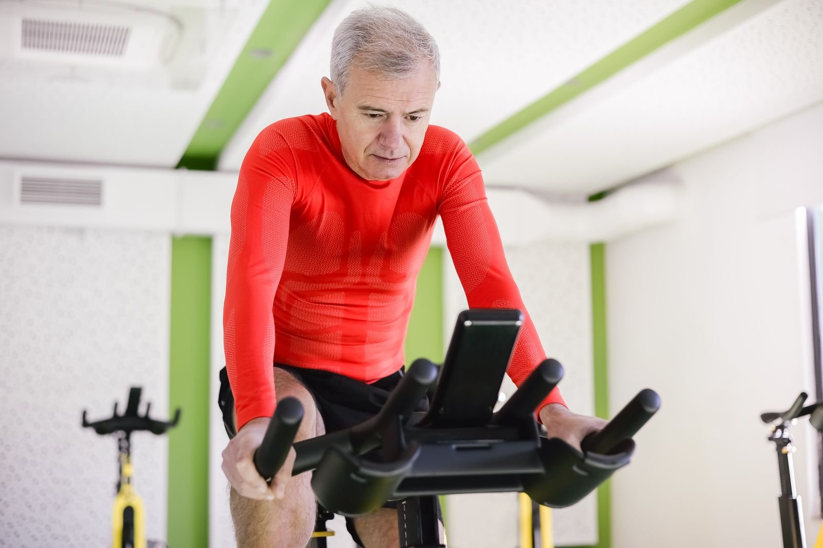 Older man exercising on a stationary bike