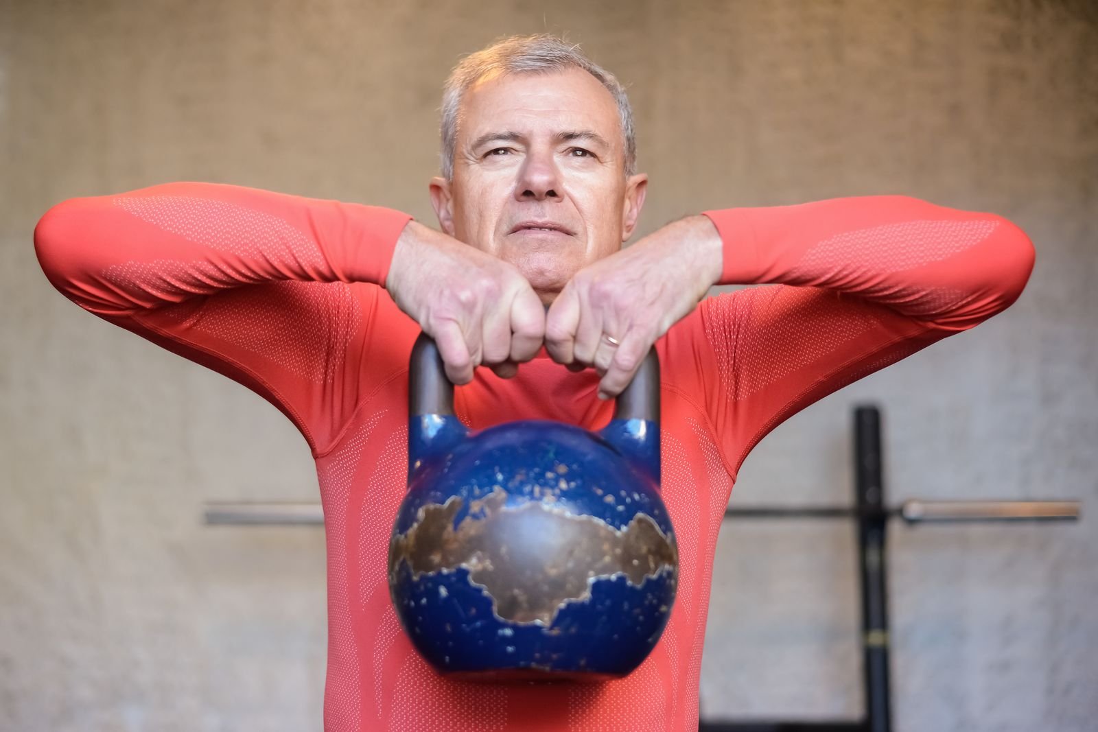 Older man training with a kettlebell