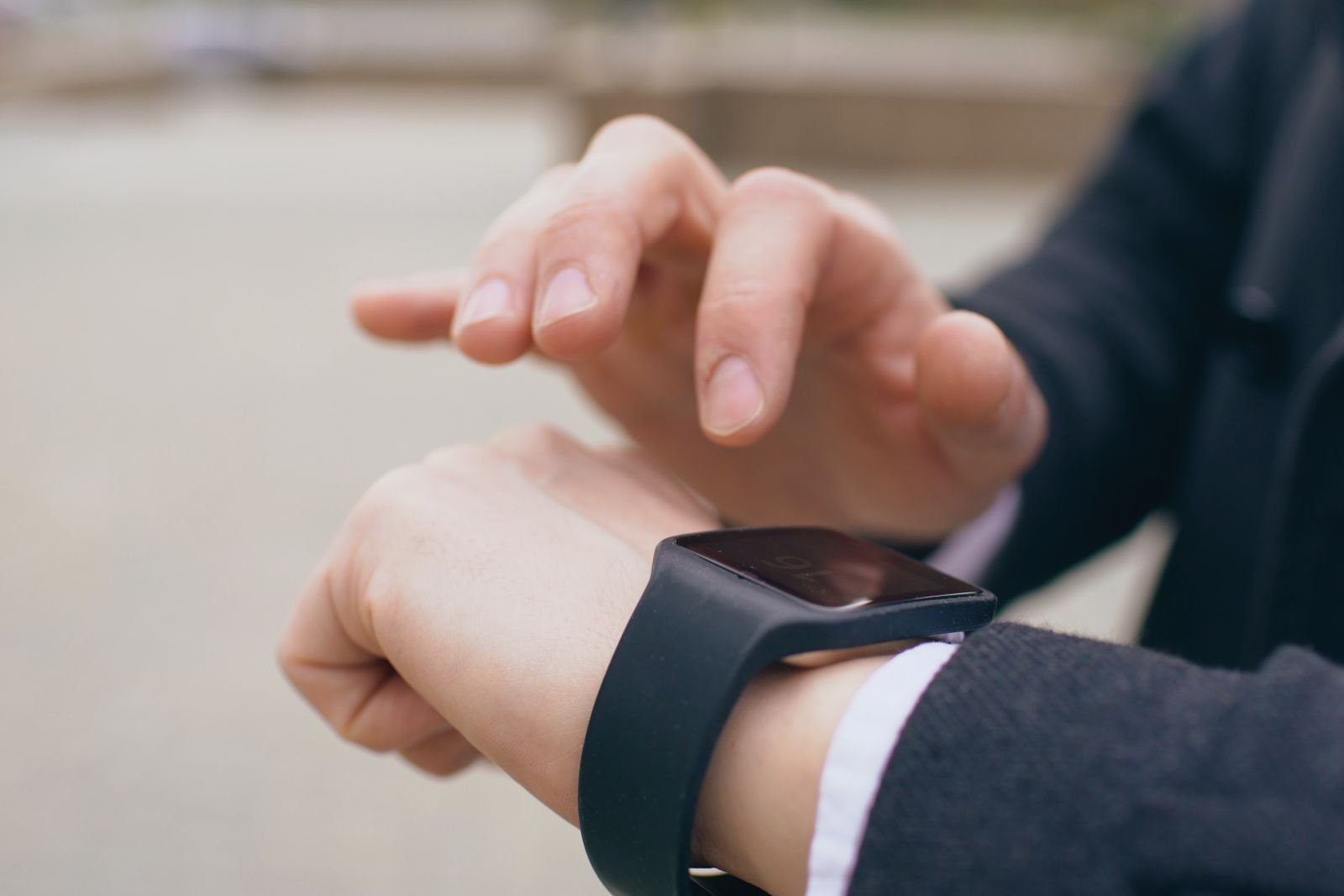 Person checking a smartwatch on their wrist