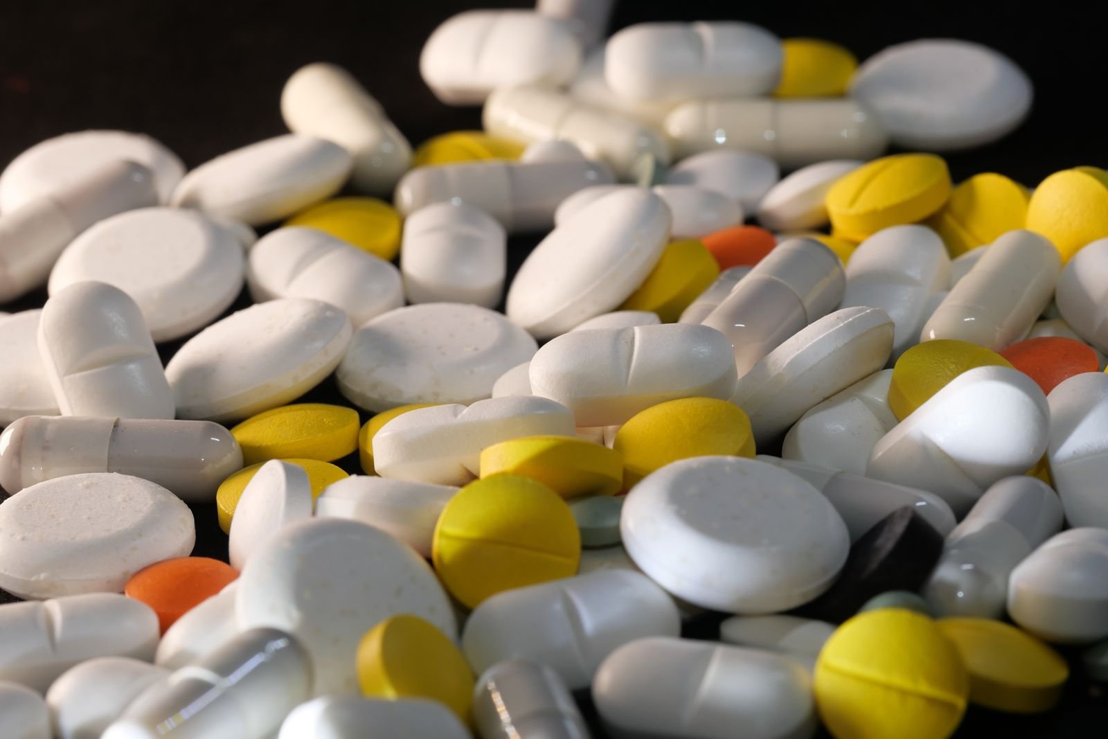 Pile of assorted tablets and capsules