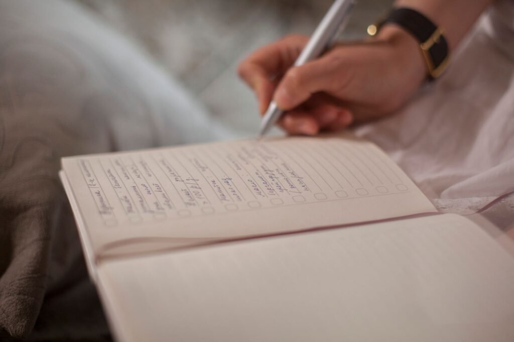 Hand writing training notes in a notebook