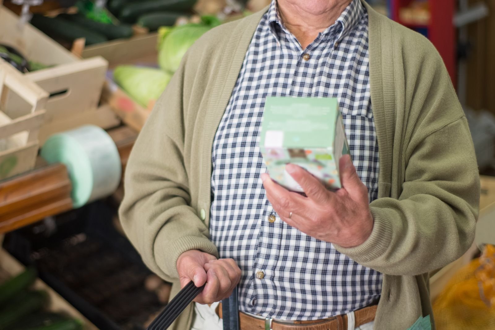 Shopper reading the nutrition label on a package