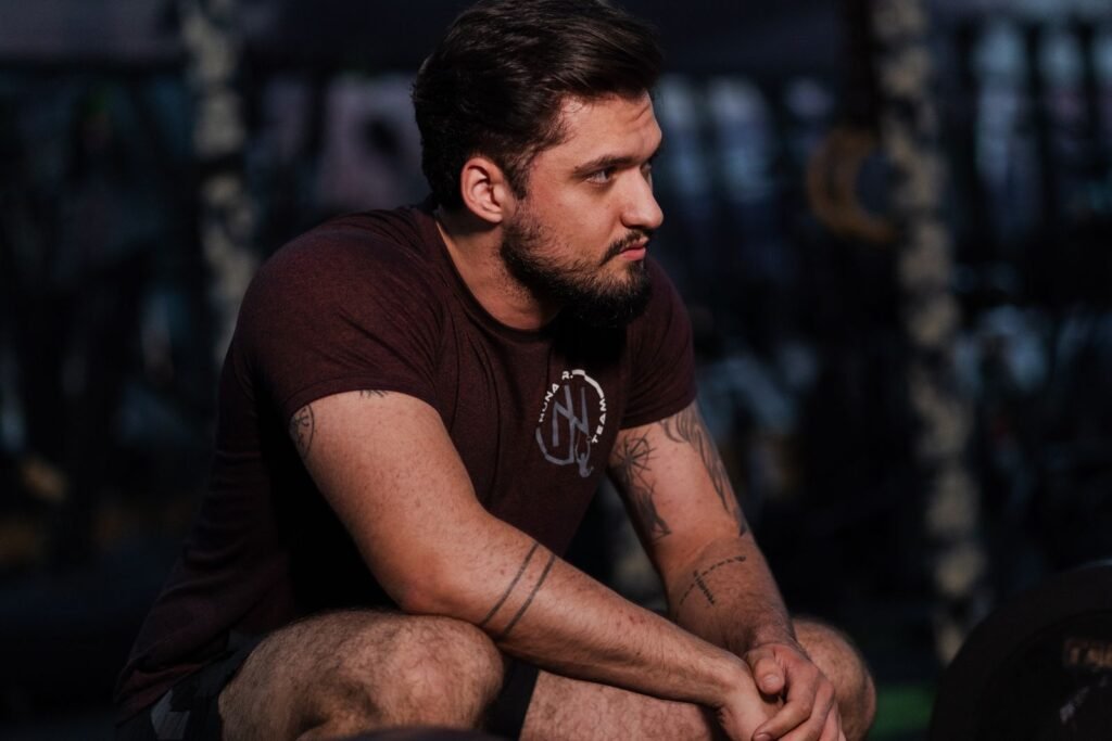 Athlete resting between sets in the gym