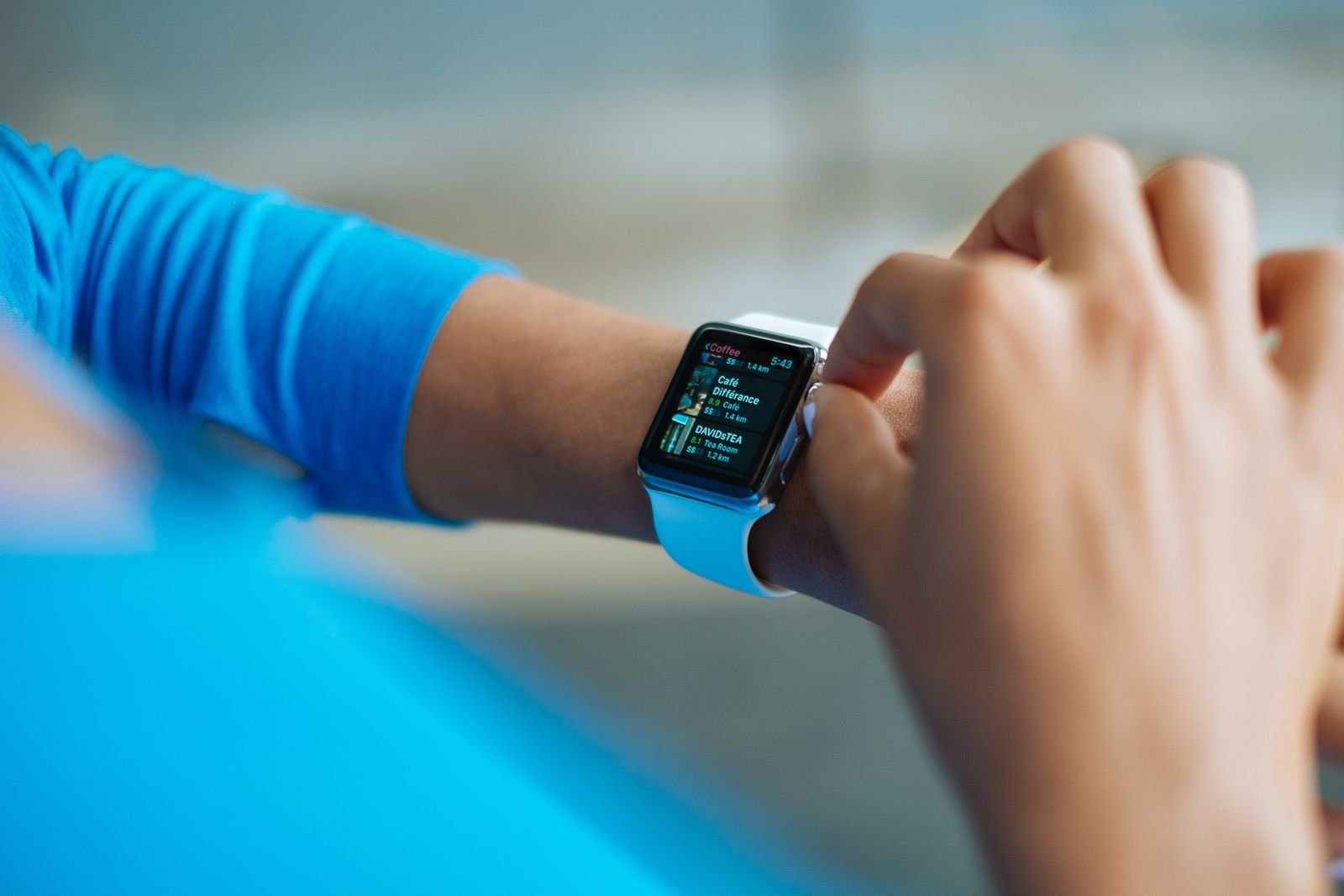 Smartwatch showing a fitness app on a wrist