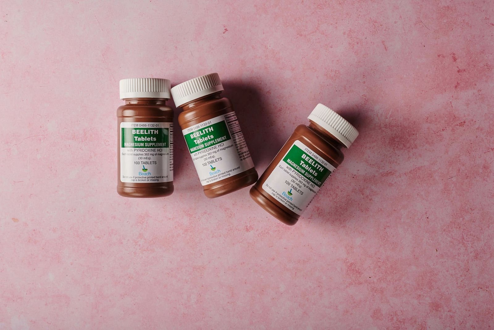 Supplement bottles arranged on a plain background