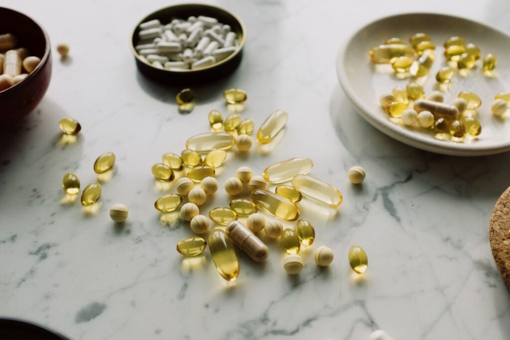 Collection of capsules and tablets on a marble surface
