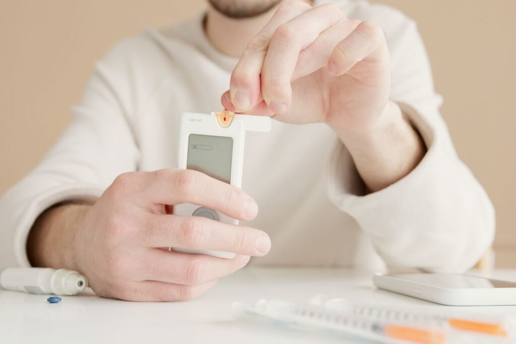 Man checking his blood sugar with a glucose meter