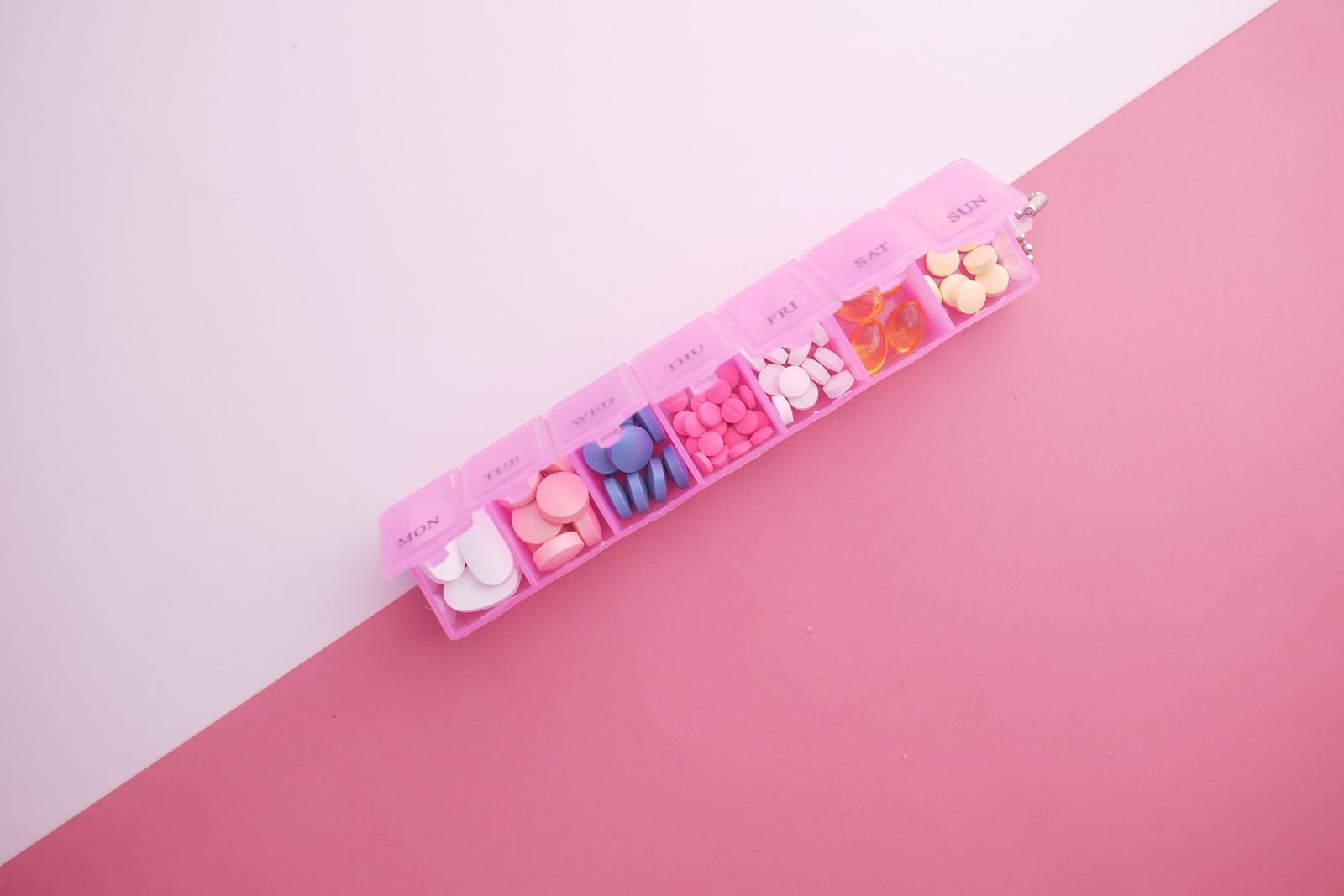 Weekly pill organiser filled with capsules